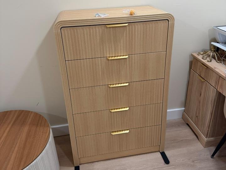 A five-drawer oak dresser assembled by Pamphile Assembly